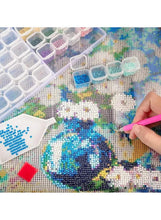 Transparent grid storage box used to sort small bead-like items by color
