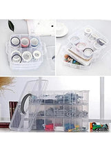 Translucent three-layer storage box with gray handle showing compartment dividers