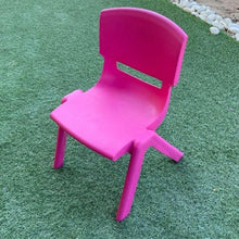 Kids plastic chair in pink, angled view with contoured seat and sturdy legs