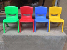 Set of 4 kids plastic chairs in green, red, blue, and yellow with wide seat backs