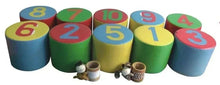 Foam number stacking blocks, colorful cylinders with numerals 1–10 and small toy pieces