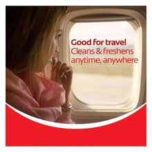 Disposable mini toothbrush held in hand with travel cleaning text overlay