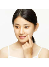 Skin care patch routine: woman smiling with hand near chin
