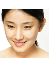 Skin care patch routine close-up: woman smiling with bare shoulders