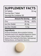 Supplement facts label and round beige spirulina tablet, zinc 50 mg per tablet