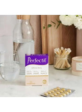 Perfectil Original skin hair nails supplement box with loose tablets on table