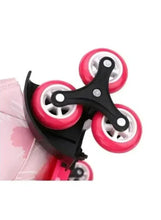 Rolling backpack wheel system with red casters on black trolley backpack