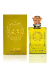 Eau de parfum bottle and matching box, yellow glass with gold cap, 60 ml