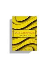 Men's perfume box with yellow-gold waves and 'OUD CASHMERE' label