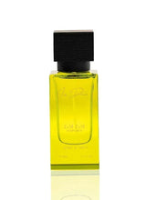 Iris Dream eau de parfum bottle with black cap and yellow glass body