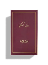 Maroon perfume box with gold border and 'Velvet Love' script