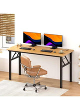 Adjustable laptop table with light wood top and black legs, two monitors and chair