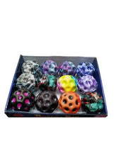 Rubber bounce balls assortment in a blue tray