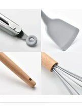 Close-up of wooden-handled silicone utensils with metal connecting rings