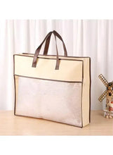 Winter duvet comforter storage bag with dark handles and clear window panel