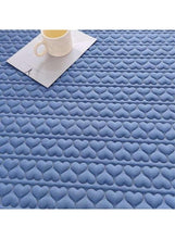Blue quilted heart-texture fitted topper top with waterproof-look finish