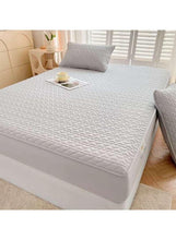 Light grey fitted bedding topper with matching pillowcase, corner fitted
