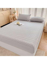 Light grey waterproof fitted bedding topper set with two matching pillowcases