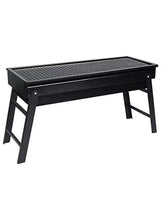 Portable charcoal grill with black metal grate and sturdy four-leg frame
