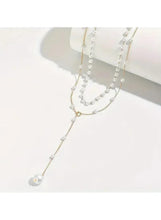 Layered pearl drop necklace with dangling pearl pendant and linked pearl stations