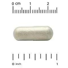White oval veggie capsule on measurement scale