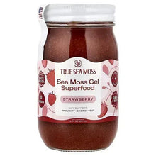 Sea moss gel jar with strawberry-flavored label, clear lid and dark red gel