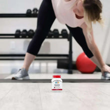 Glucosamine chondroitin tablets bottle on gym floor