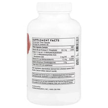 White supplement bottle back label showing Supplement Facts panel and barcode.