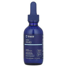 Liquid supplement bottle with dark blue dropper cap, front label