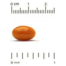 CoQ10 softgel capsule, orange-brown, shown with a size ruler
