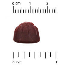 Dark red gummy with size scale marks
