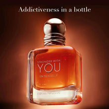 Emporio Armani men's eau de parfum bottle with orange liquid and dark metallic cap.
