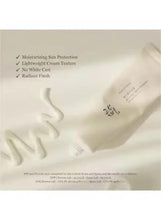 Sunscreen product packaging graphic with benefit checklist and white cream smears.