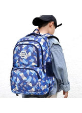 Geometric wheeled school backpack with shoulder straps, blue pattern, worn on back