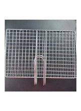Rectangular wire mesh grilling clip with two prongs, tabletop view