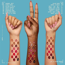 Lip gloss stain color swatches on hands with numbered shades in rows