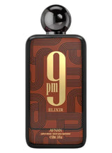 Unisex extrait de parfum bottle with glossy black cap and gold “9 pm Elixir”