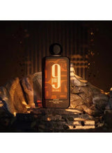 Unisex extrait de parfum bottle with tall black cap and gold “9 pm” label