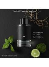 Men’s eau de parfum bottle with black textured body and chrome cap on dark backdrop