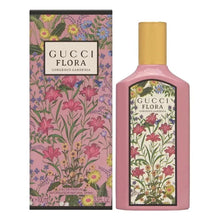 Eau de parfum bottle with pink glass and gold cap beside a 100ml floral gardenia gift box