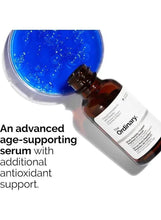 Serum bottle with dropper, amber liquid and blue gel smear