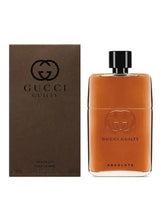 Gucci eau de parfum set with orange bottle, black cap, and matching box