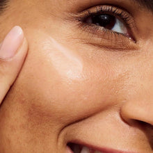 Close-up of eye and cheek skin with fine texture and subtle dark spot area