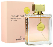 Women’s eau de parfum bottle, gold cap and round charm