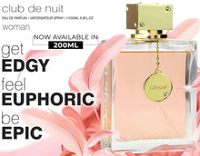Women’s eau de parfum bottle with gold cap and dangling round charm