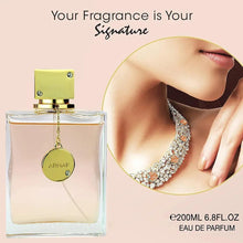 Women’s eau de parfum bottle with gold cap and hanging ARMAF charm