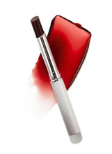 Lipstick and applicator with red-brown shade on a glossy, fan-shaped smear