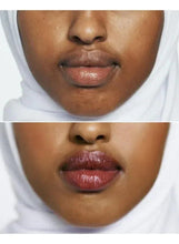 Close-up of lips wearing a deep berry-brown lipstick shade