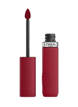 Matte liquid lipstick in dark berry red, black cap, and bullet applicator