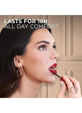 Matte liquid lipstick wand with red lipstick tip, applied to lips